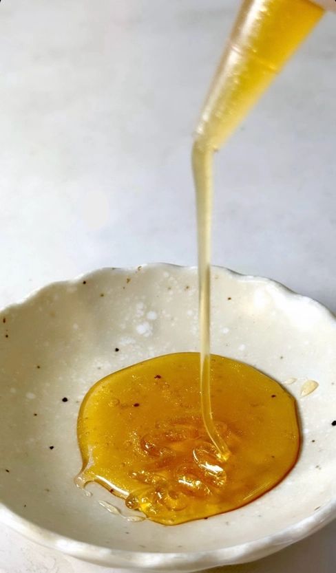 Mushroom Honey drizzled from a spoon